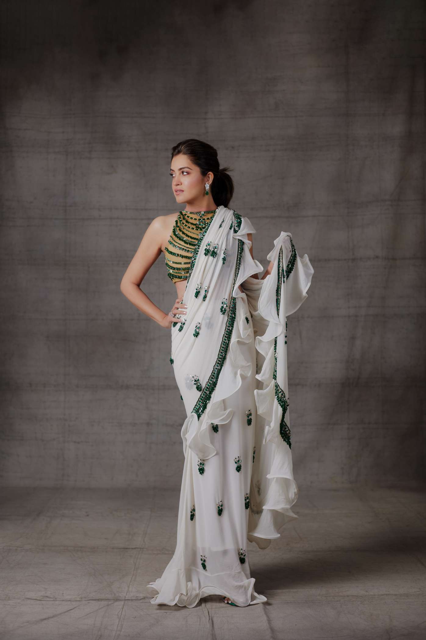Ivory Ruffle Georgette Saree with Emerald Stone Motifs and Border