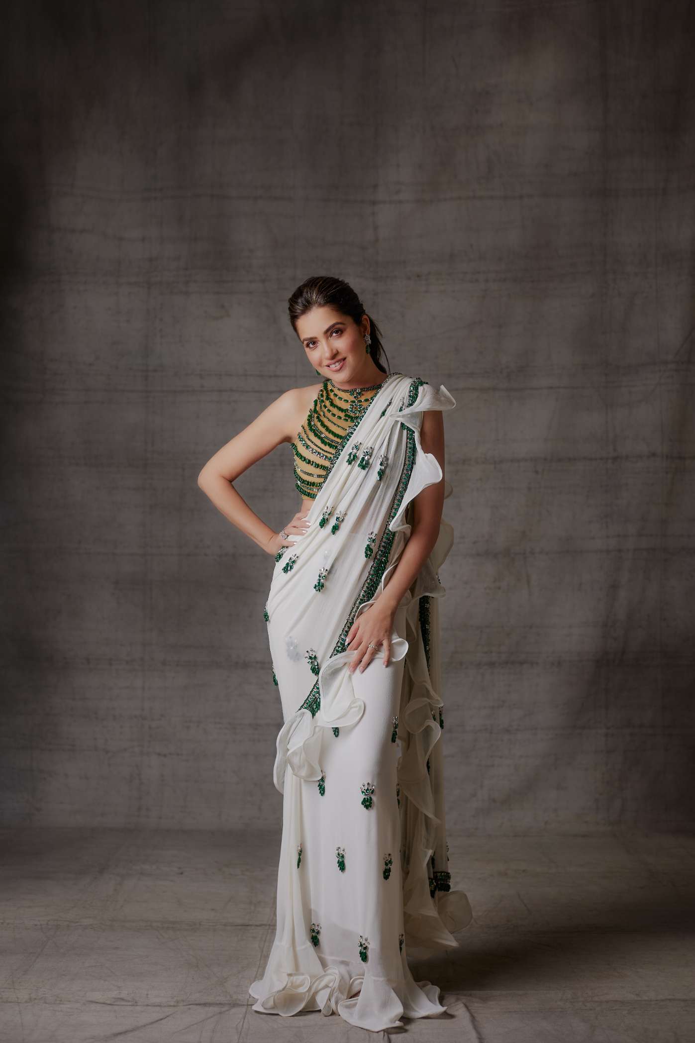 Ivory Ruffle Georgette Saree with Emerald Stone Motifs and Border