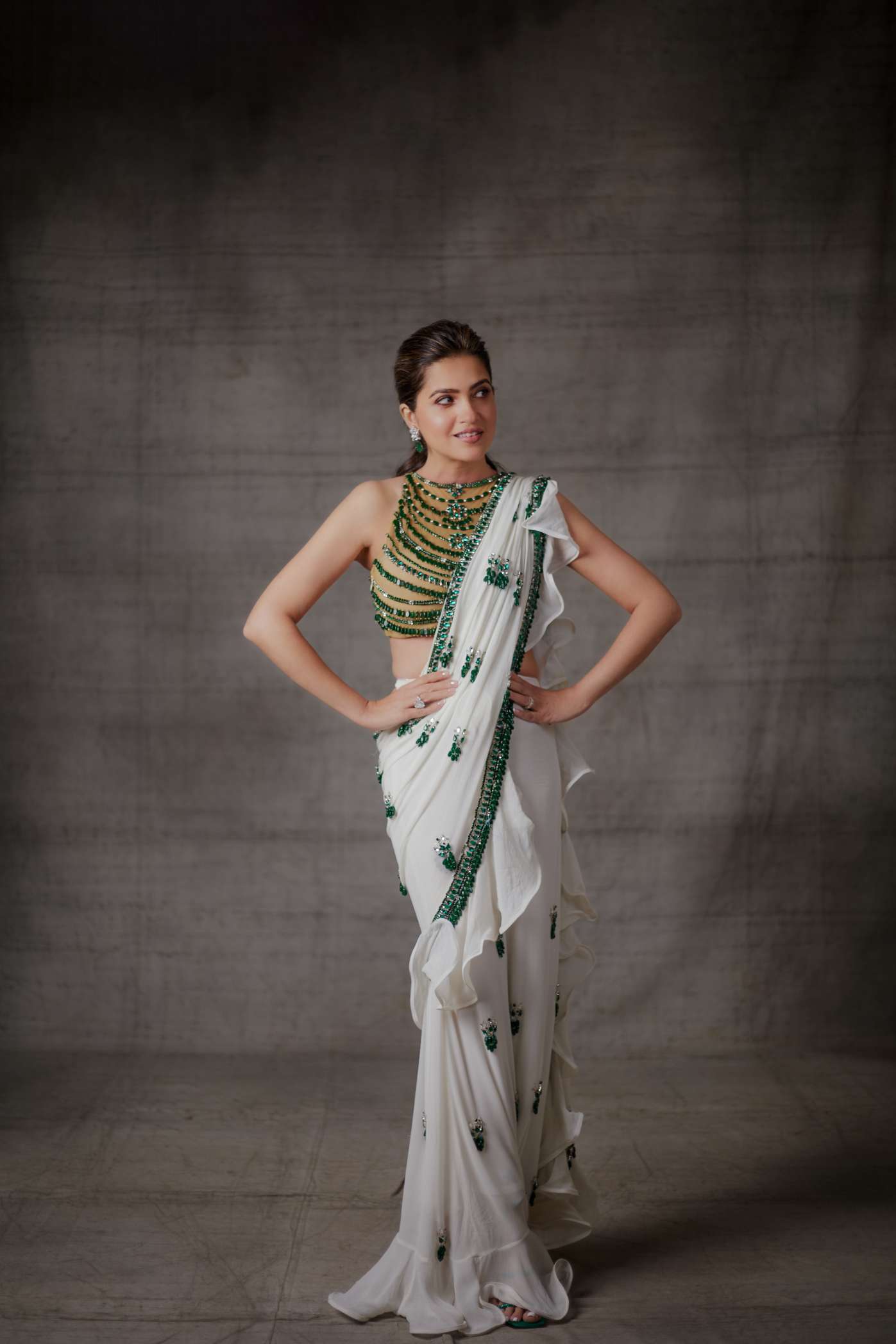 Ivory Ruffle Georgette Saree with Emerald Stone Motifs and Border