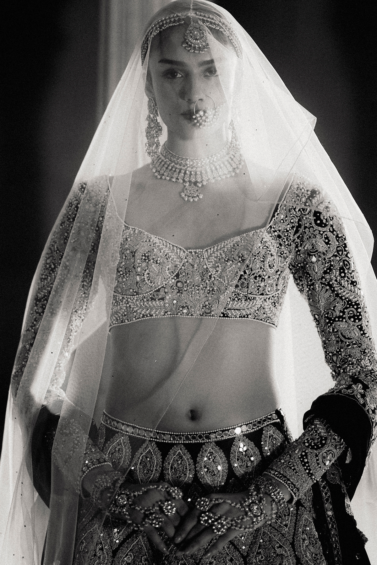 Black full-sleeved blouse and lehenga with heavy gold cord embroidery and an embroidered dupatta