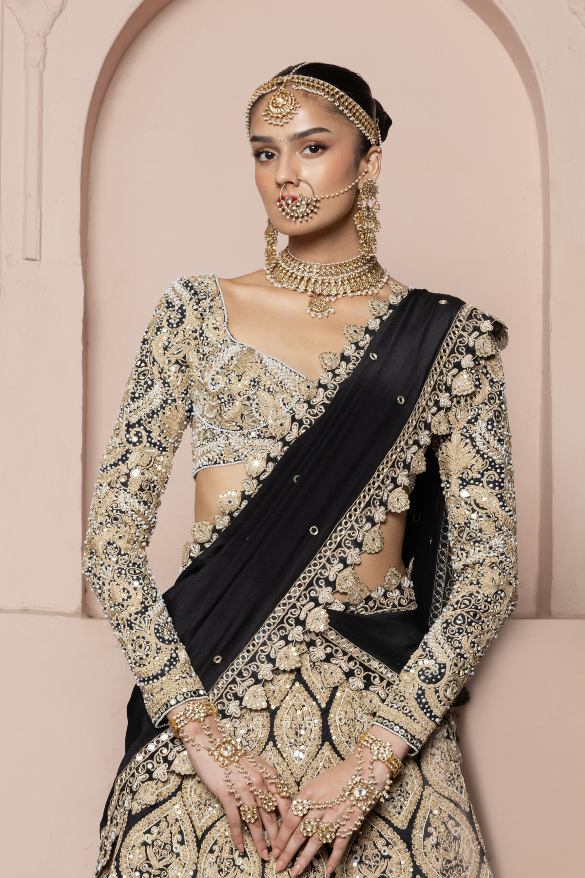 Black full-sleeved blouse and lehenga with heavy gold cord embroidery and an embroidered dupatta