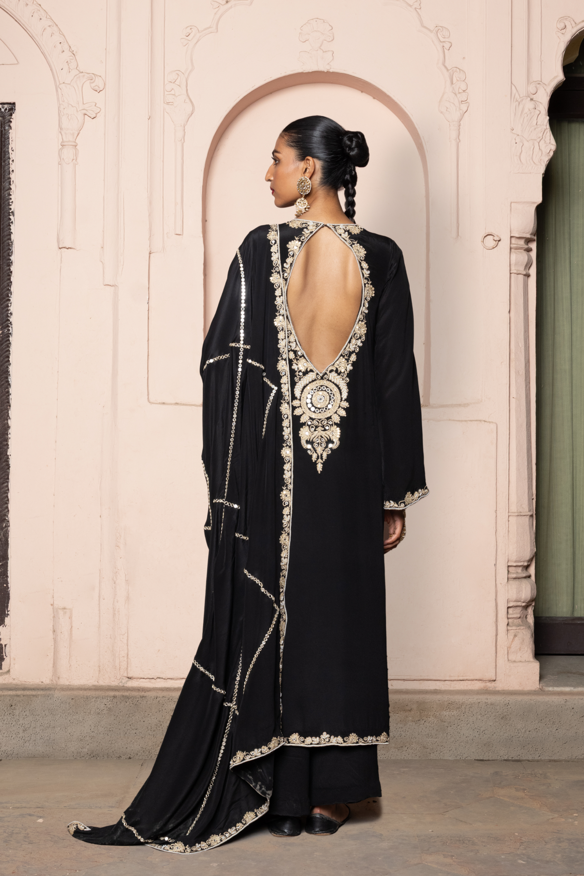 Black kurta set with a checked dupatta featuring gold cord and mirror embroidery