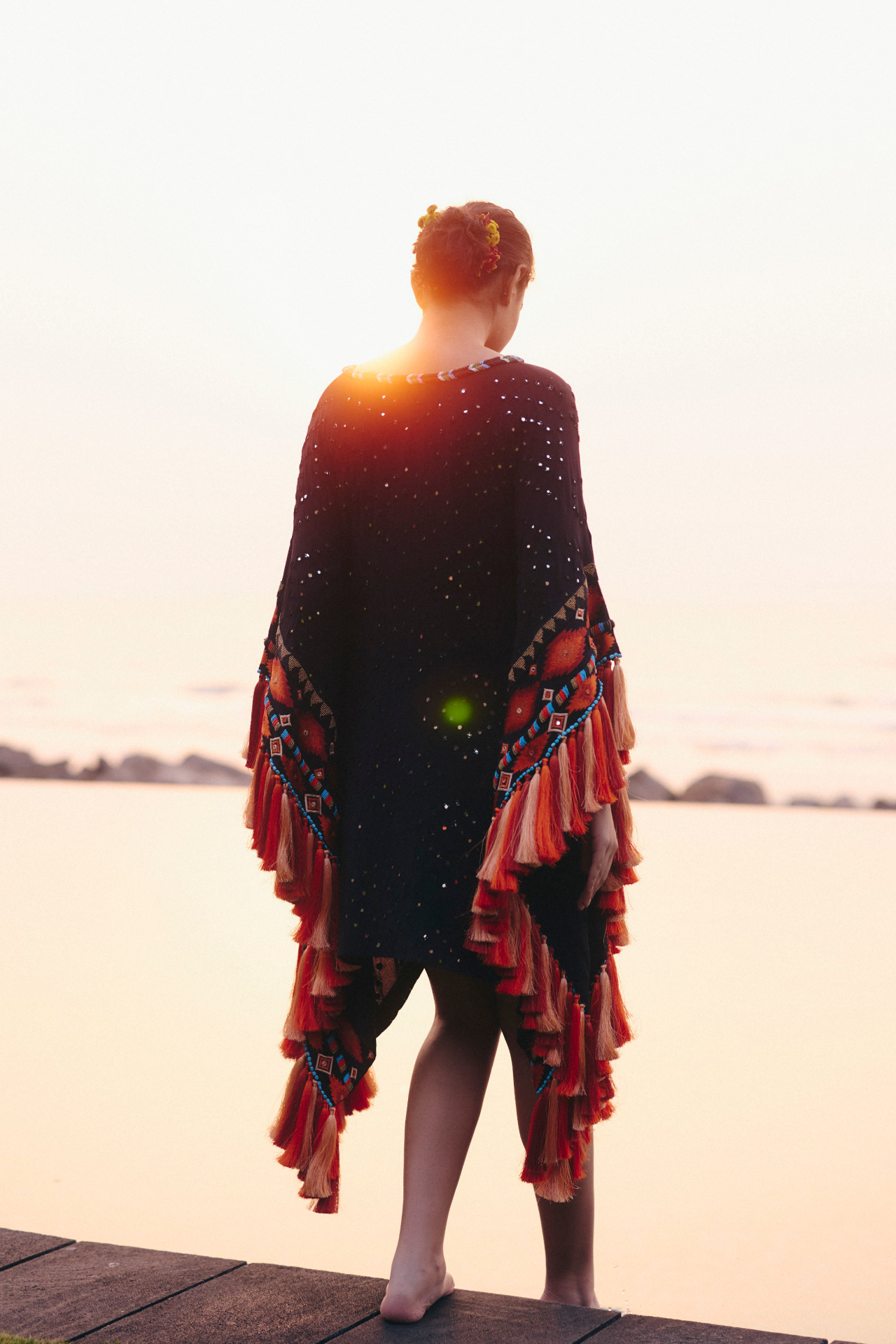 Black short kaftan with Aztec border and tassels