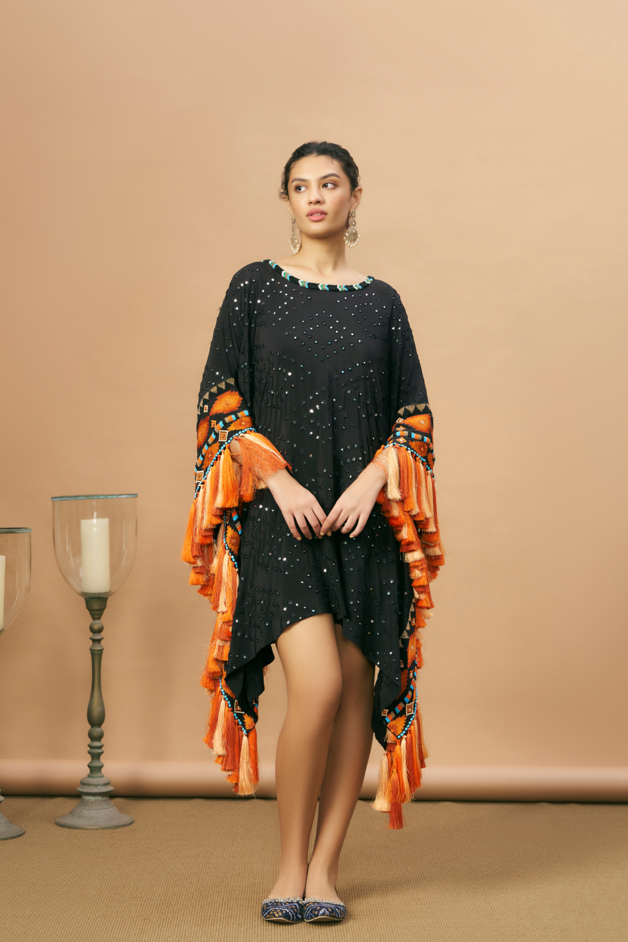 Black short kaftan with Aztec border and tassels