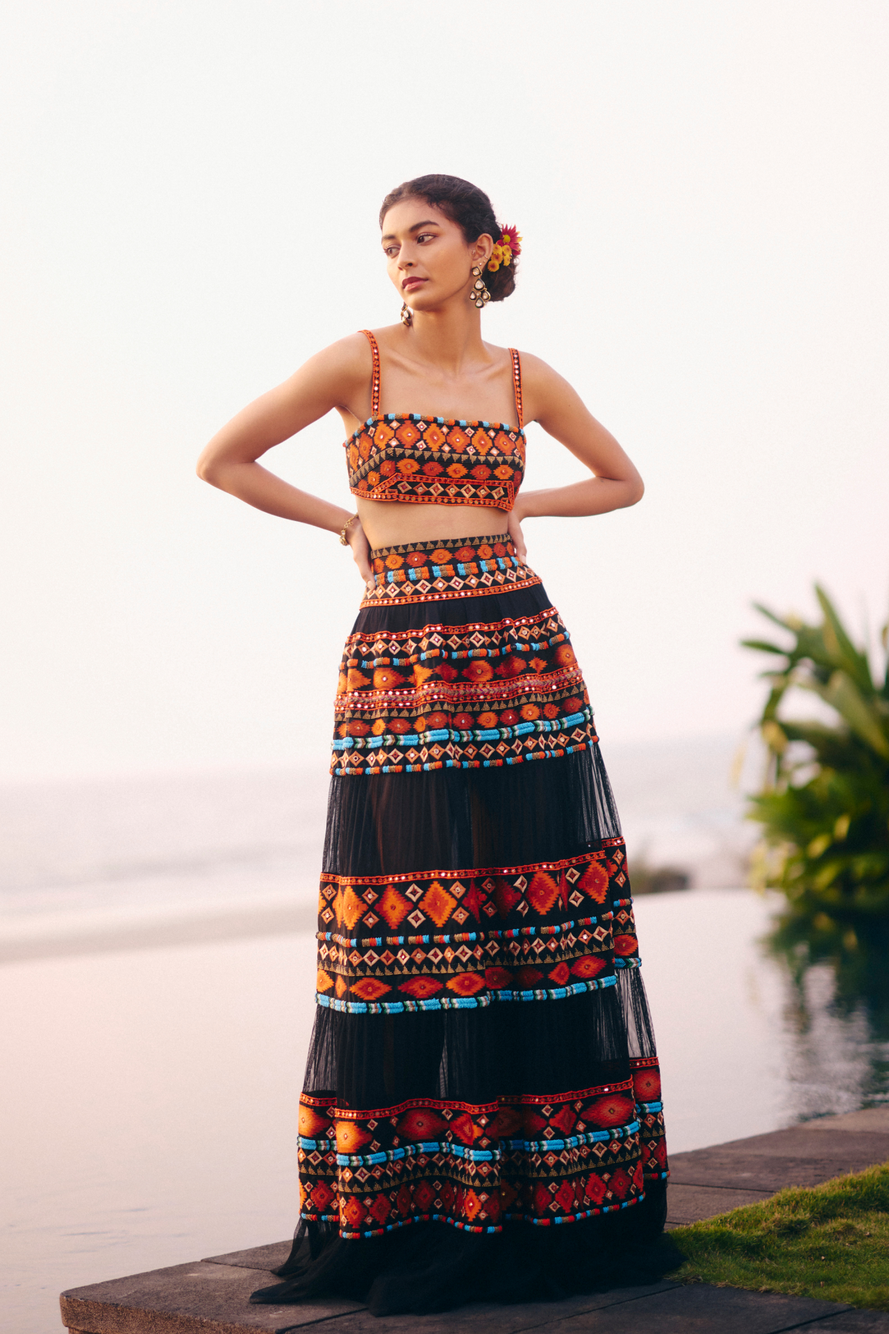 Black strappy blouse and tiered skirt with Aztec embroidery