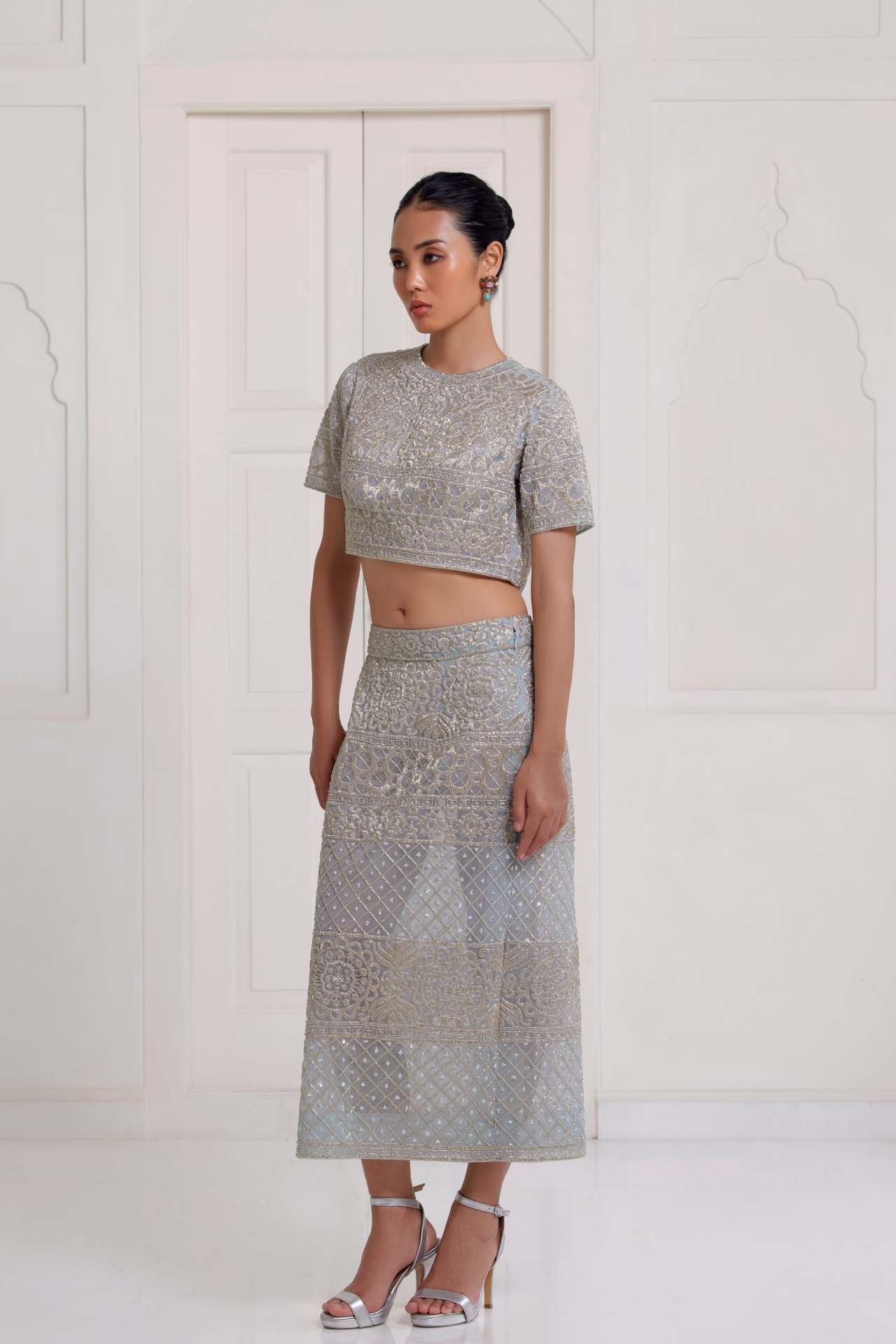 Blue crop top and straight skirt with silver cutbead embroidery