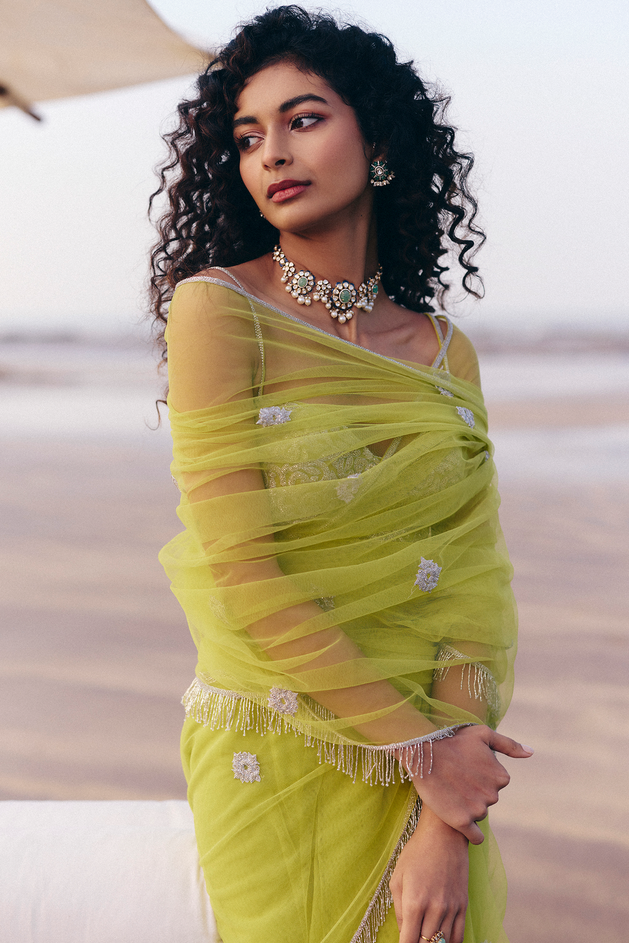 Green strappy blouse and saree with silver cutbead embroidery