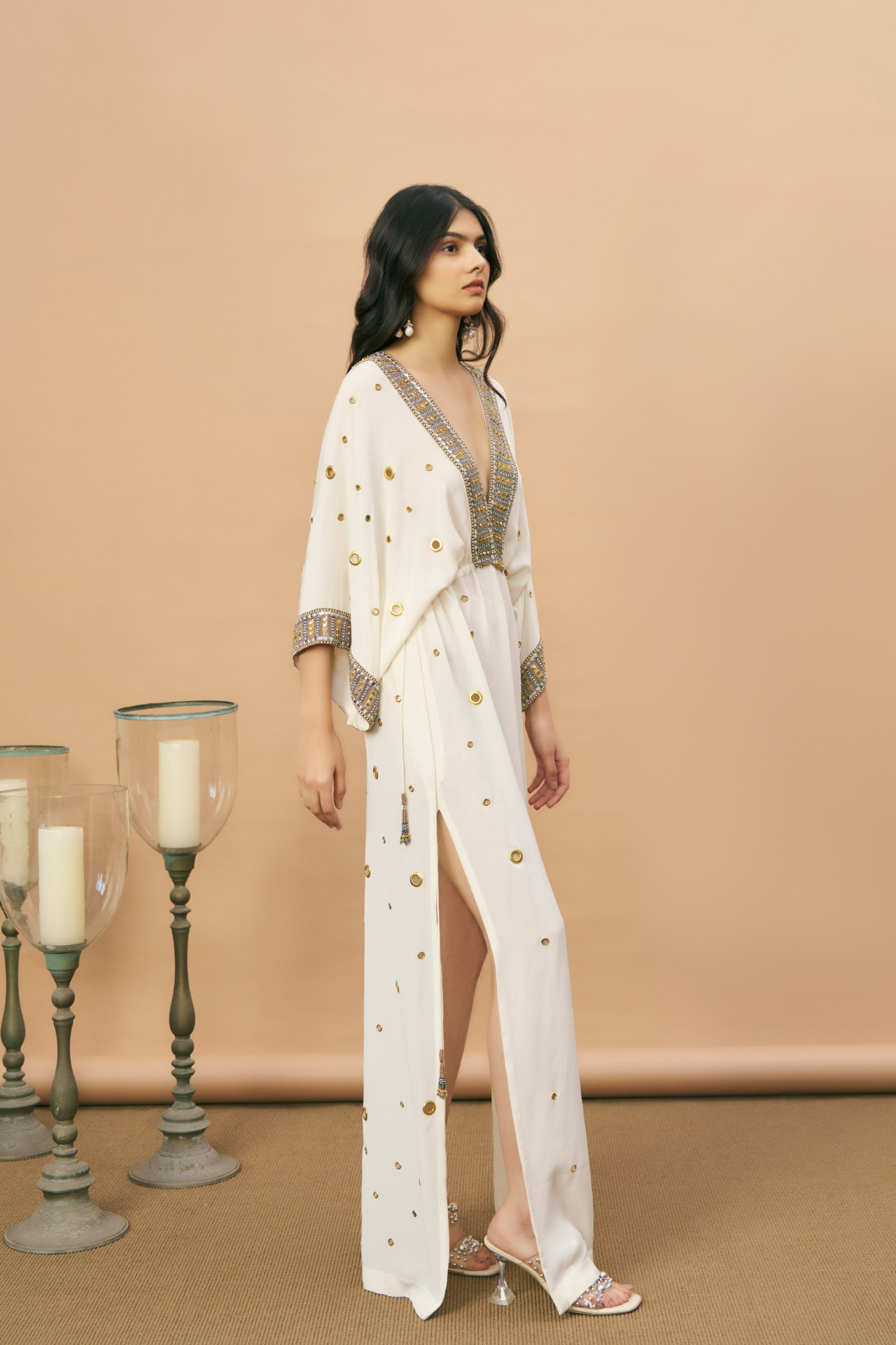 Ivory kaftan with embroidered neckline and gold rivet detailing
