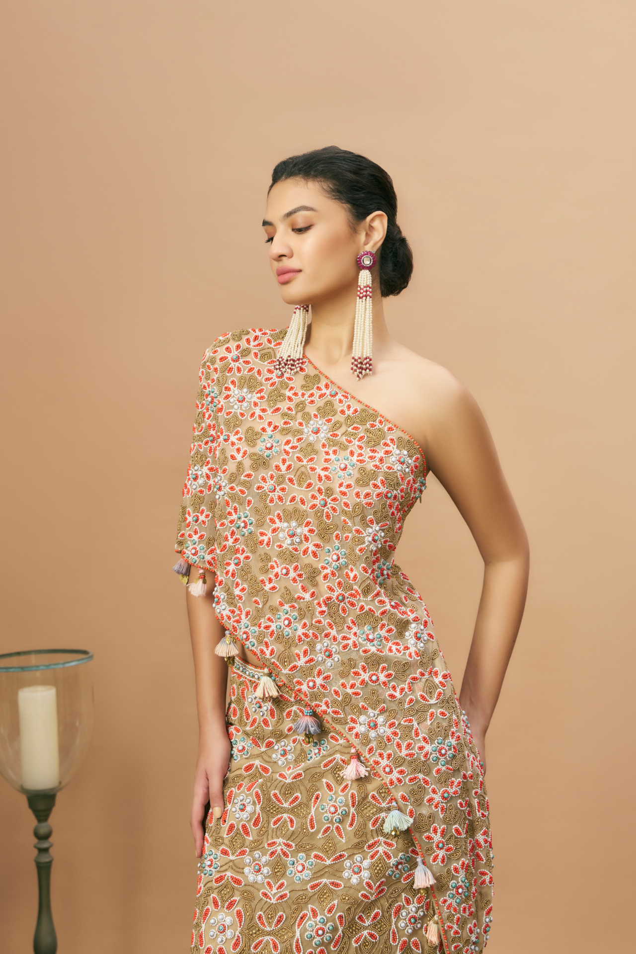 Nude one-shoulder blouse and long skirt with coral embroidery