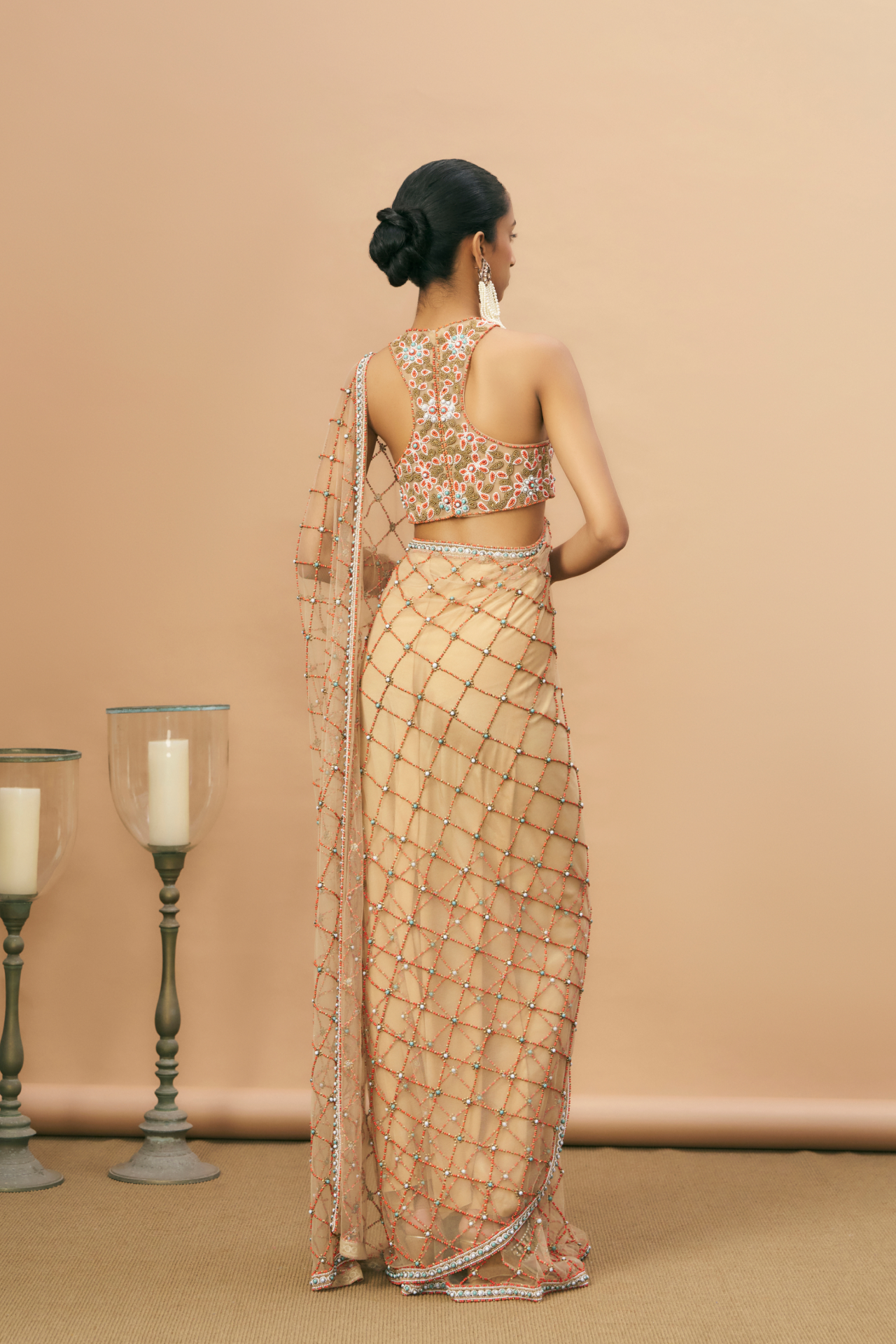 Nude racerback blouse and saree with coral embroidery