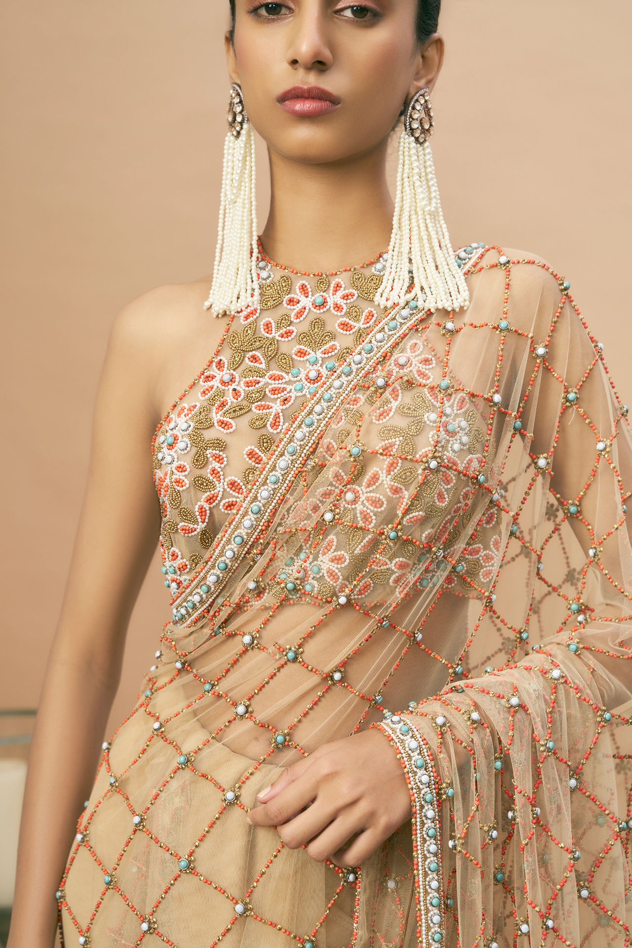 Nude racerback blouse and saree with coral embroidery